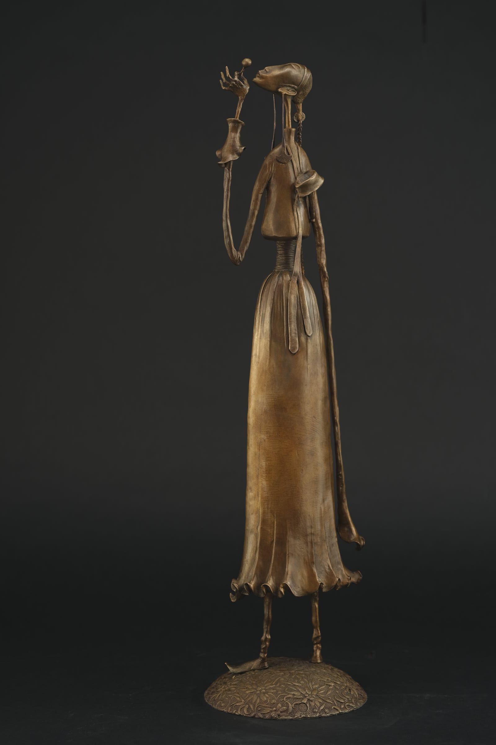 A Girl Blowing a Dandelion